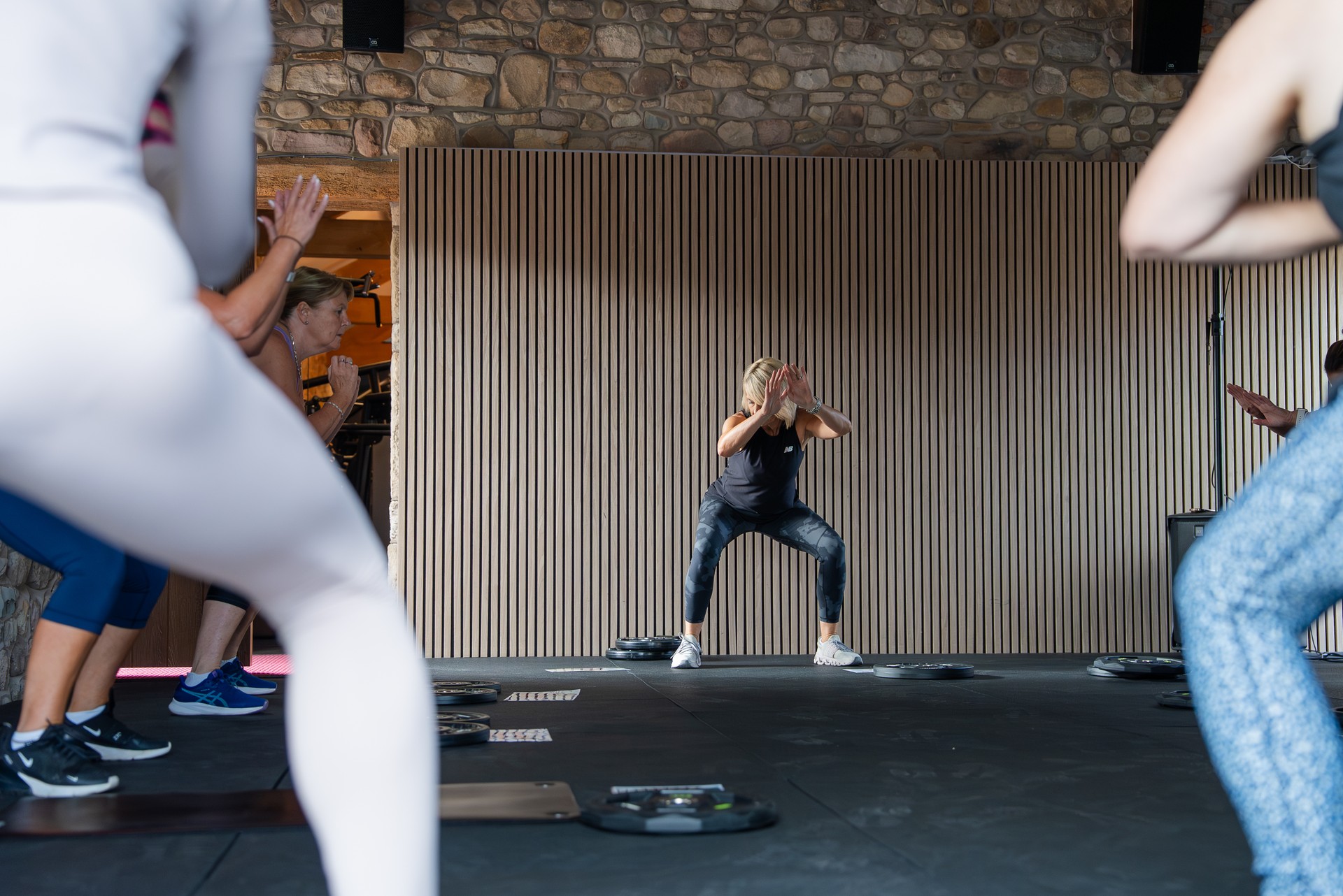 Members moving through a circuit class in the barn